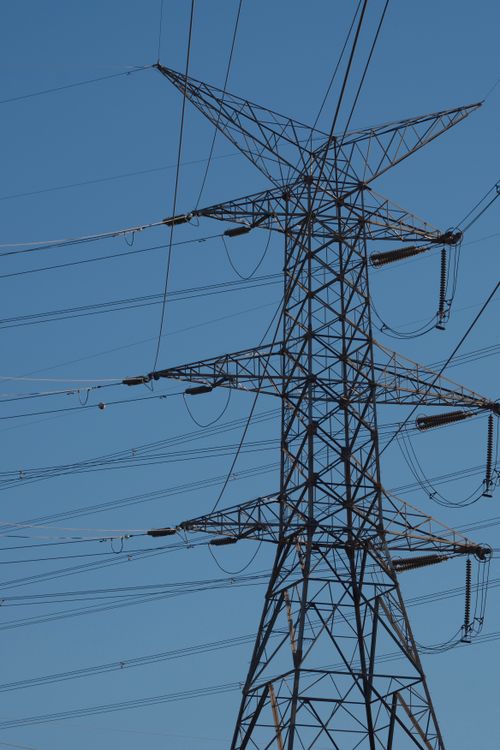 Transmission tower and power lines — photo by Doğan Alpaslan Demir on Pexels