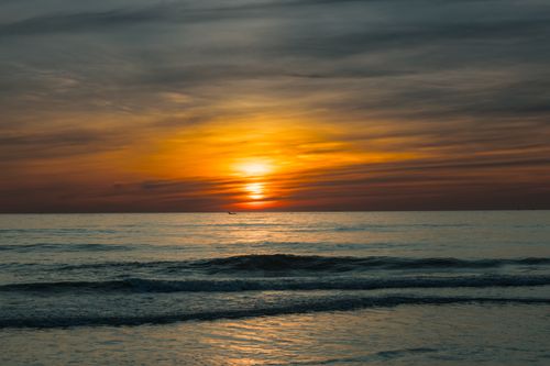Free Beautiful sunrise over the ocean in Quảng Trị, Vietnam, showcasing vibrant colors and serene waves. Stock Photo