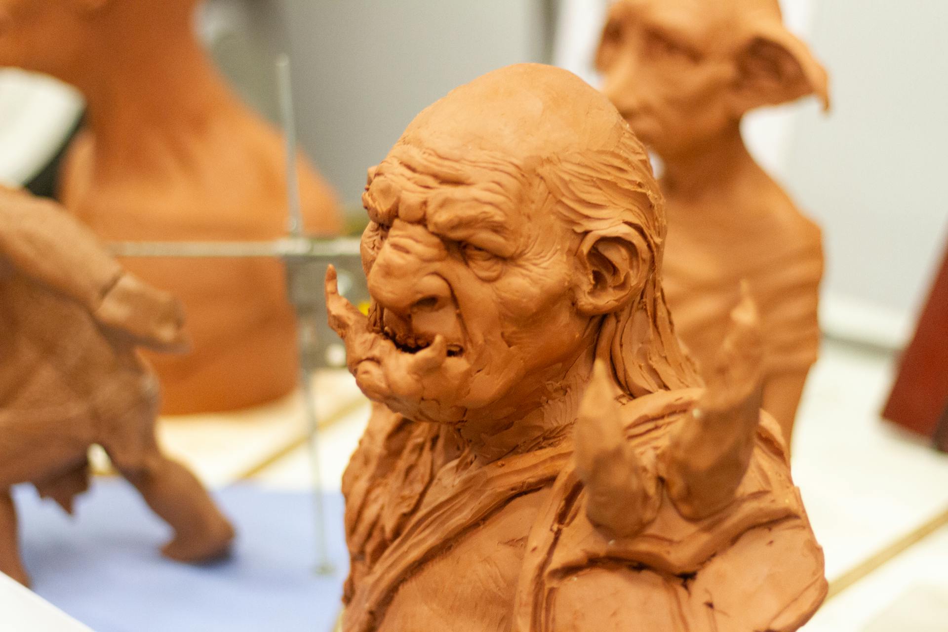 Earthen figurine of angry fictional creatures