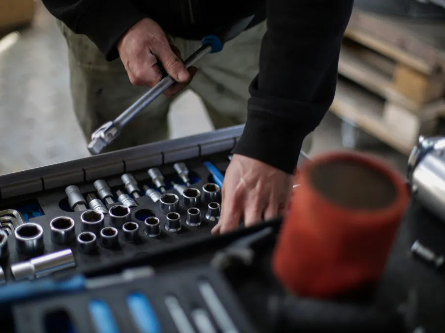 Technician selecting tools for a service visit
