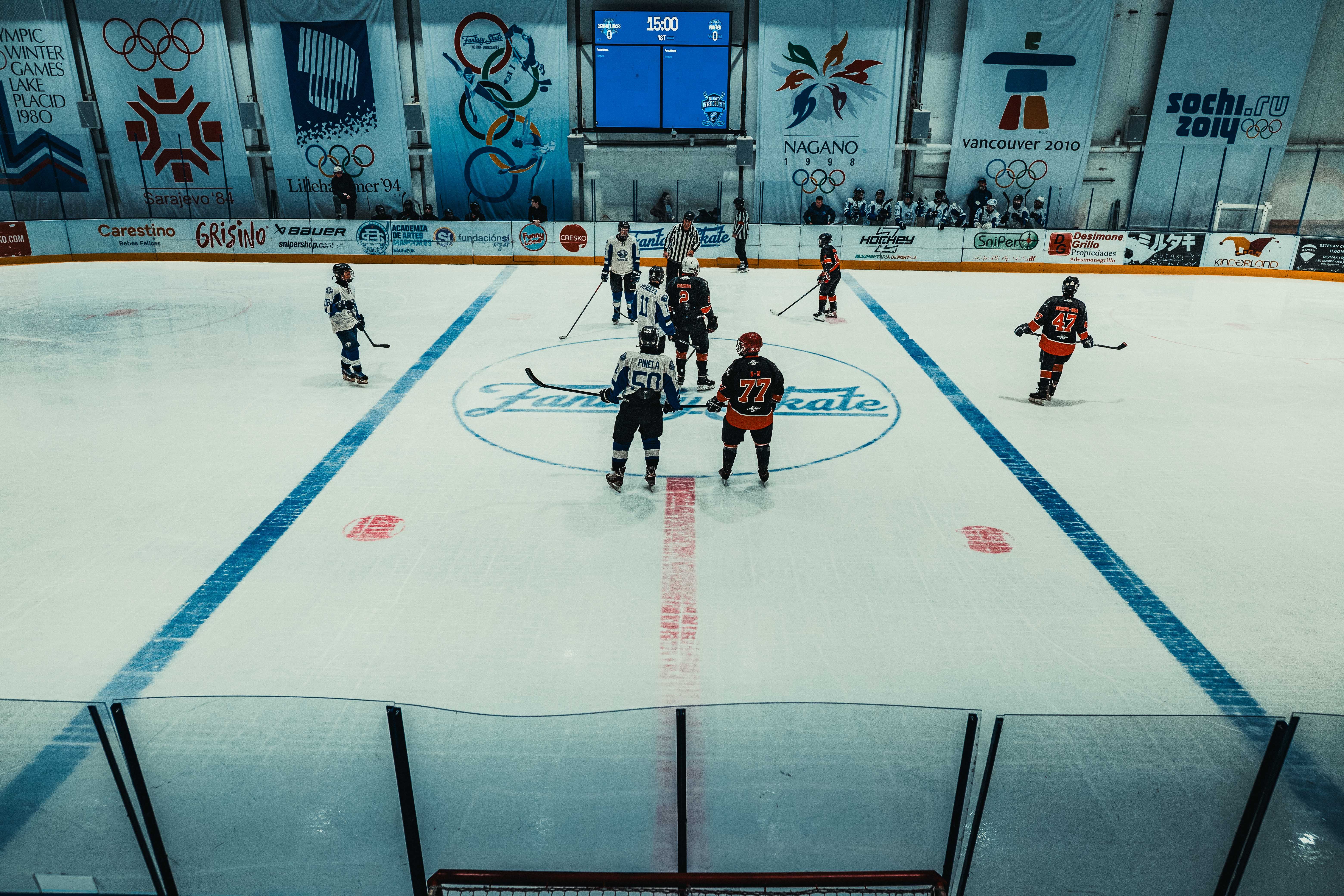 NBA photo featuring Exciting ice hockey match at Buenos Aires arena featuring opposing teams facing off. Perfect for sports enthusiasts.