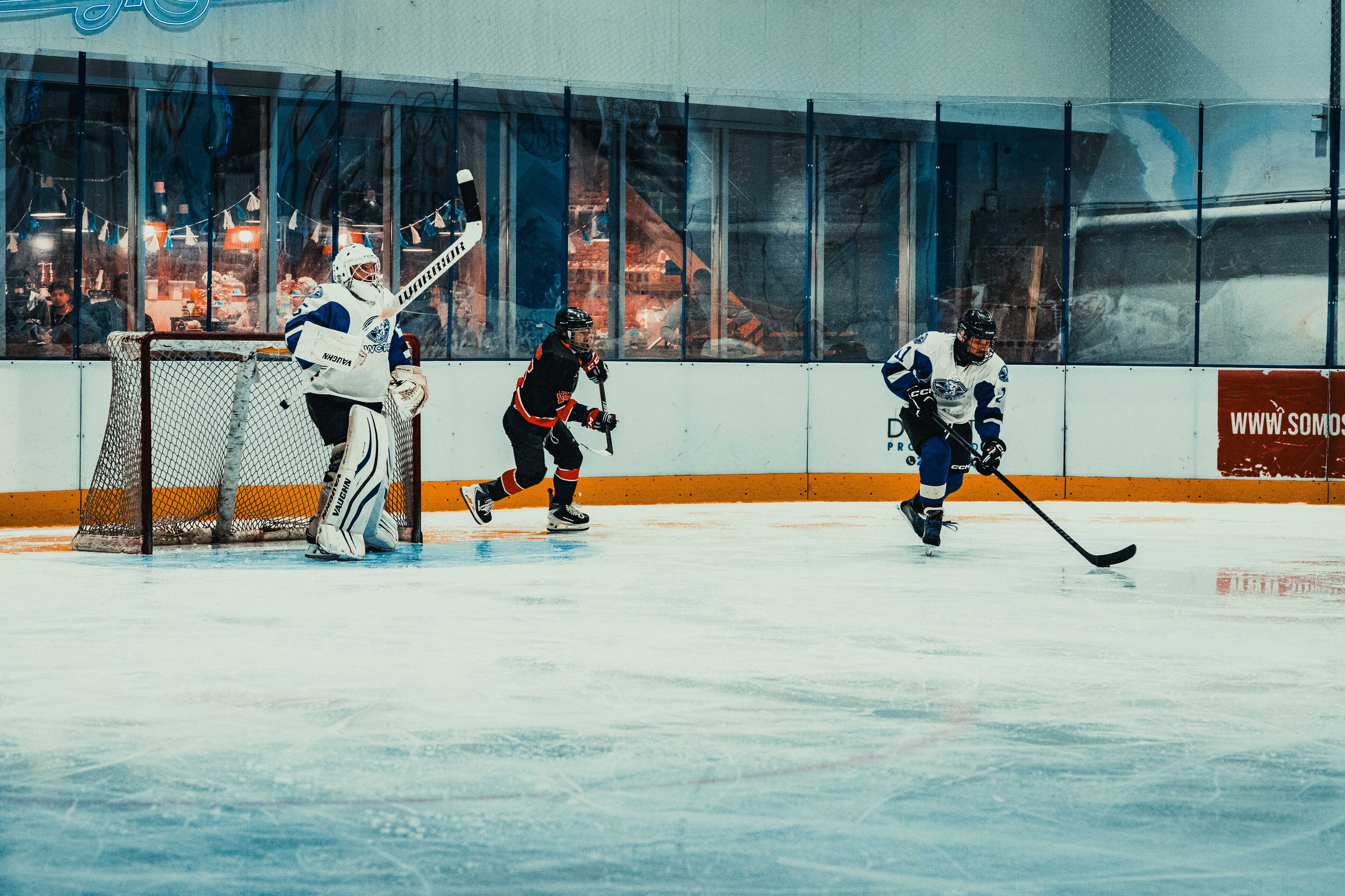 Exciting ice hockey game action with players competing intensely on the rink in Buenos Aires.