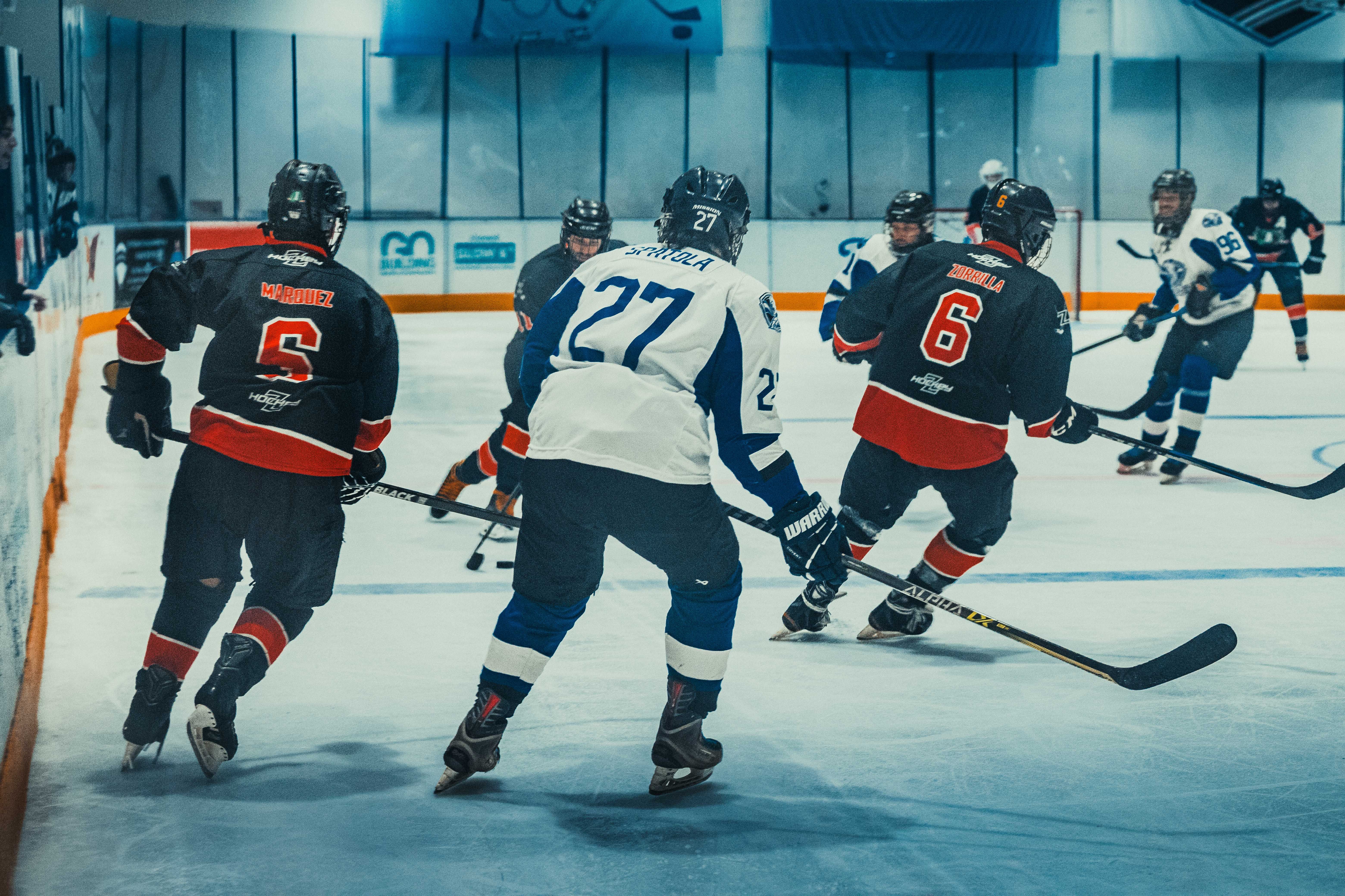 NHL photo featuring Competitive ice hockey match in Buenos Aires featuring players in action on indoor rink.