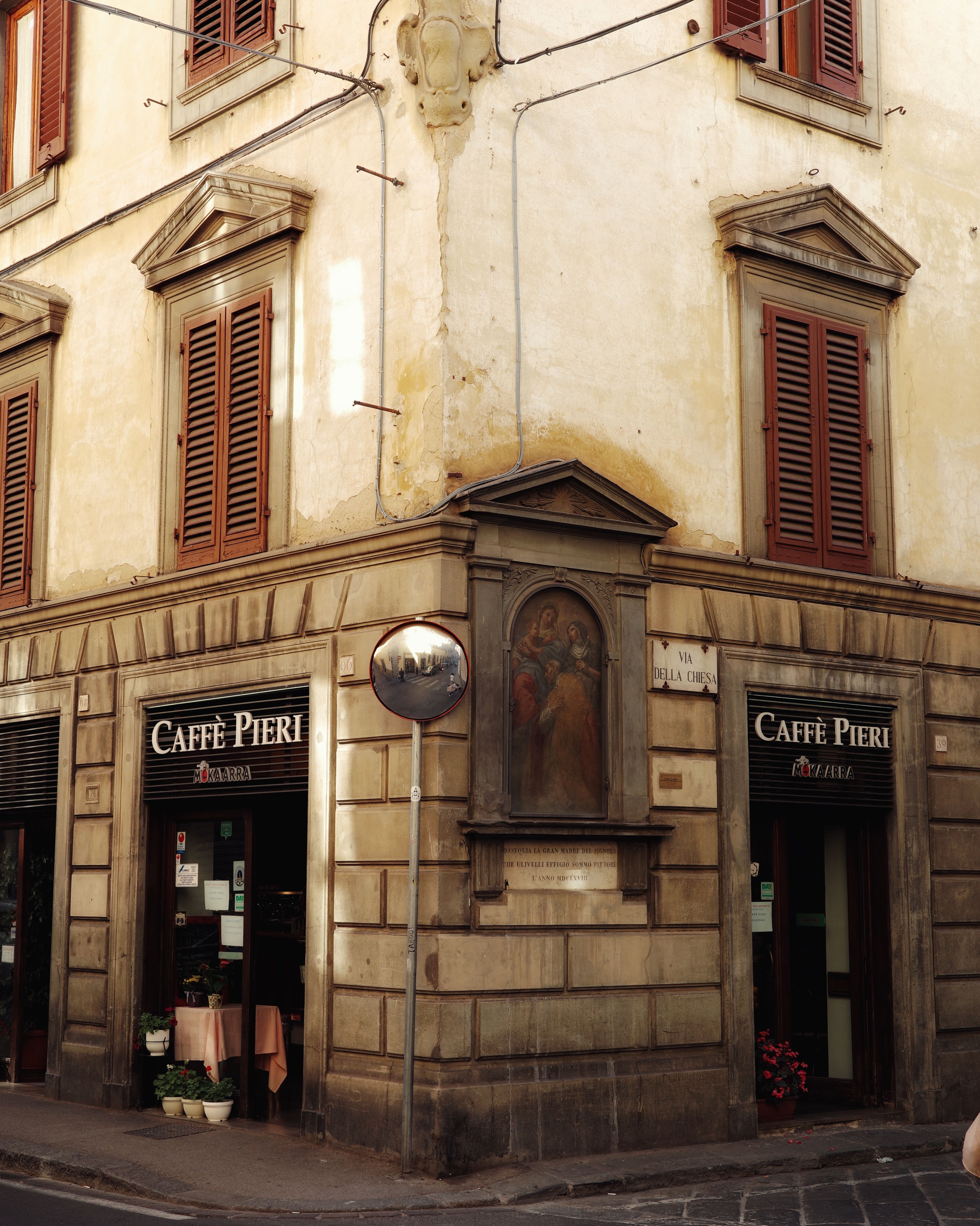Historic Caffè Pieri on a sunlit corner in Florence, Tuscany, Italy.
