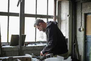 Adult male mechanic working in garage