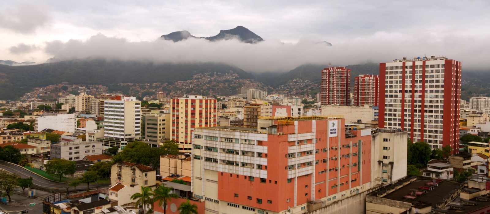 Captivating aerial view of Caracas with urban skyline and misty mountains in the background. — flights from Guayaquil to Caracas
