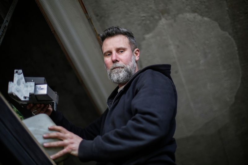 Portrait of a bearded man in an industrial environment