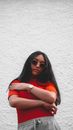 Woman in Orange T-shirt Wearing Black Sunglasses
