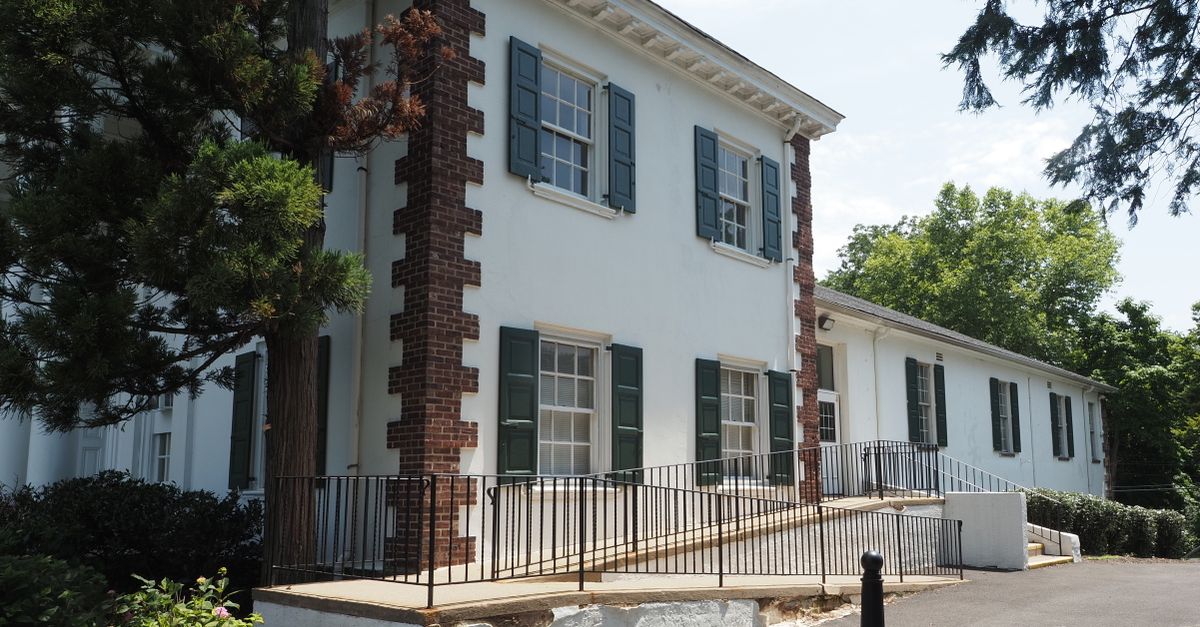 A beautiful Colonial-style building with shutters and brick details in Doylestown, Pennsylvania.