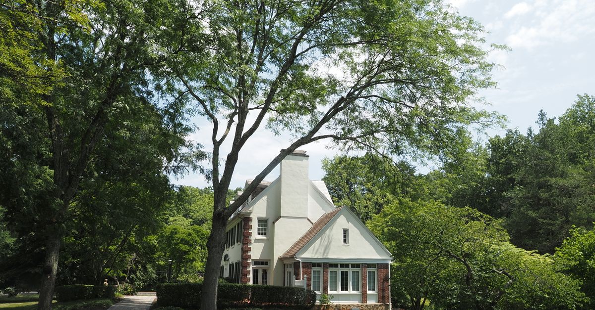 Beautiful residential house nestled among trees in a serene Doylestown setting.