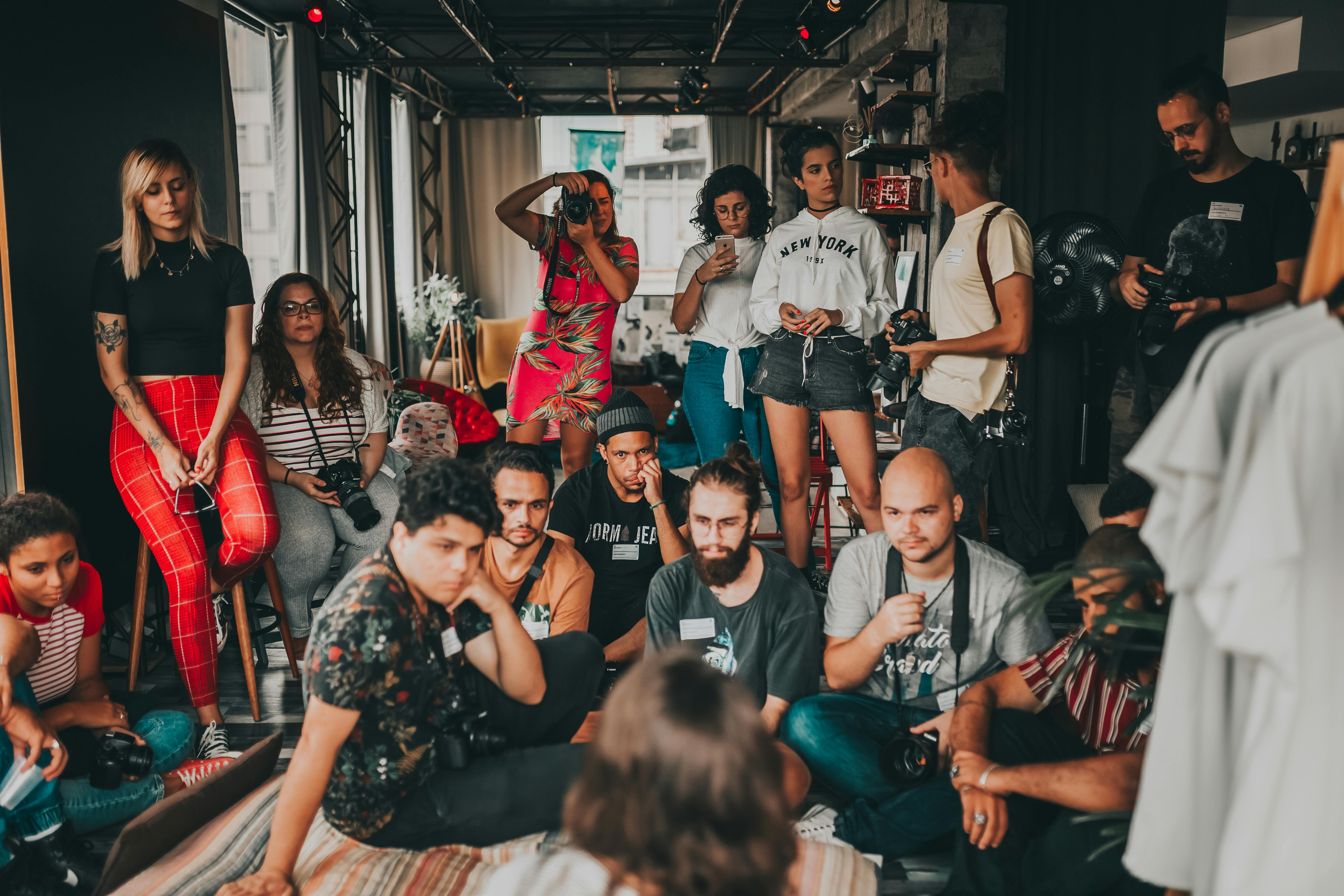 group of diverse people gathering and listening to lecture