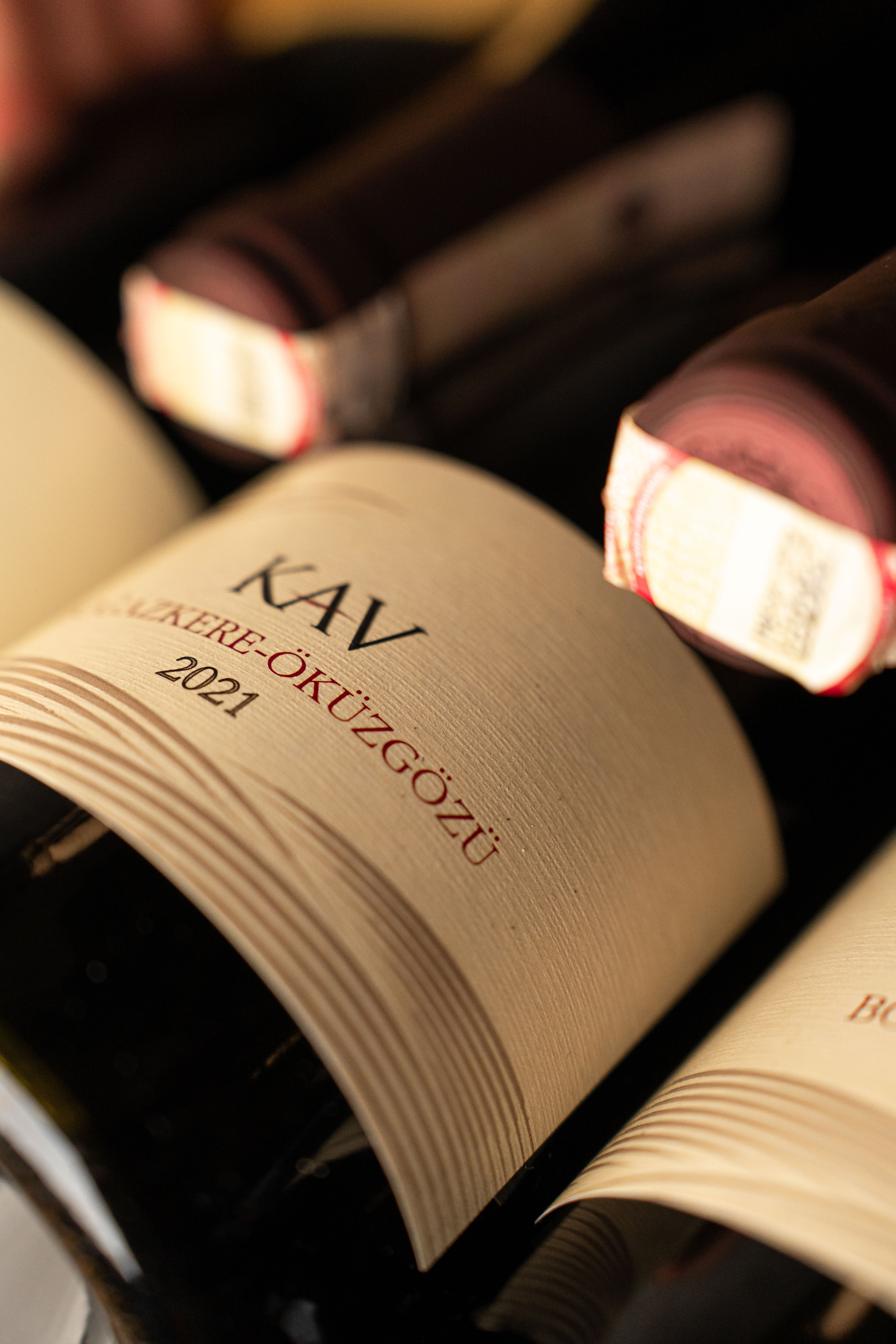 Close-up view of Kav 2021 wine bottles showcasing their elegant labels and rich colors.