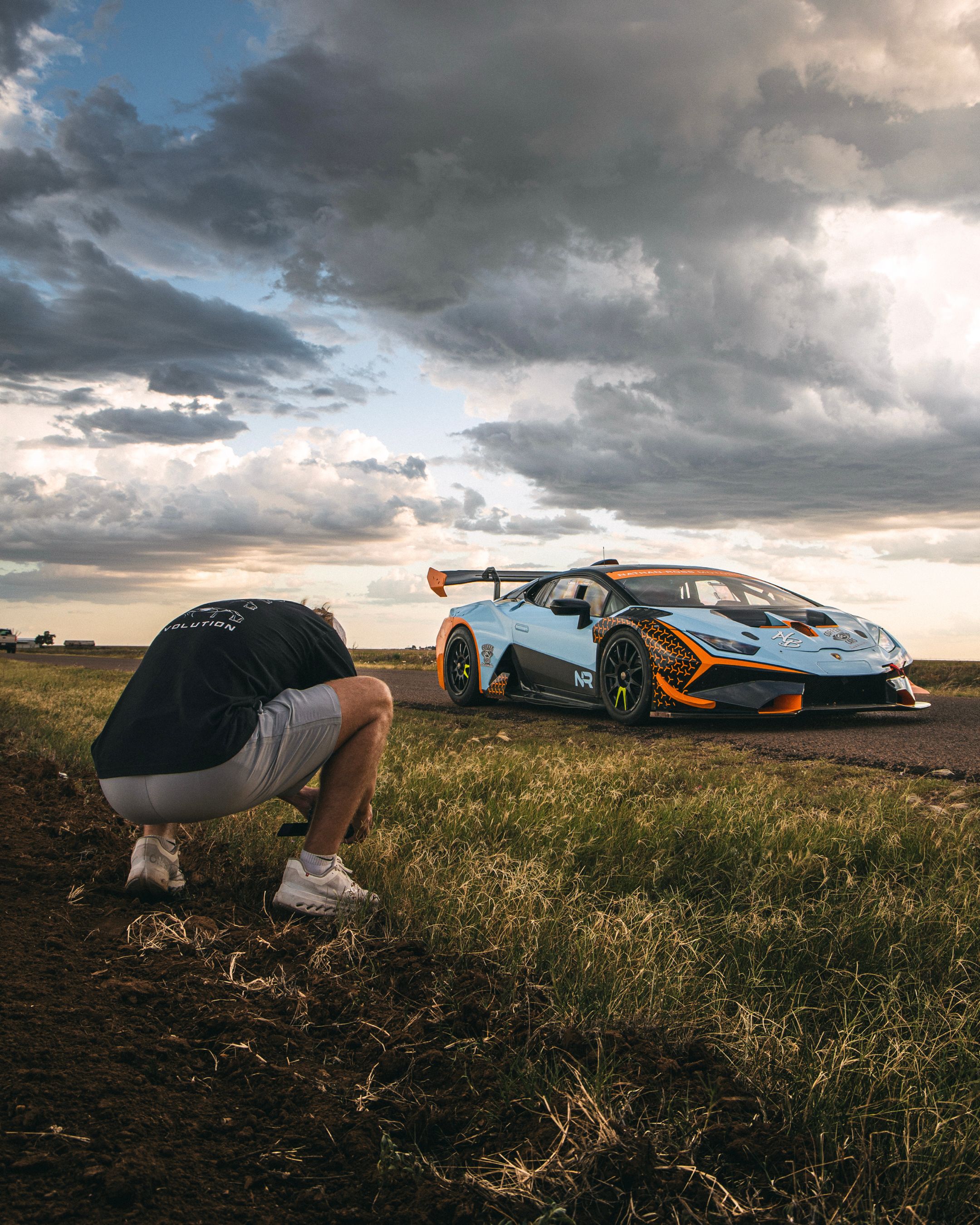 How to freeze a race car through the fencing — lens choice, shutter speed, and the fence line
