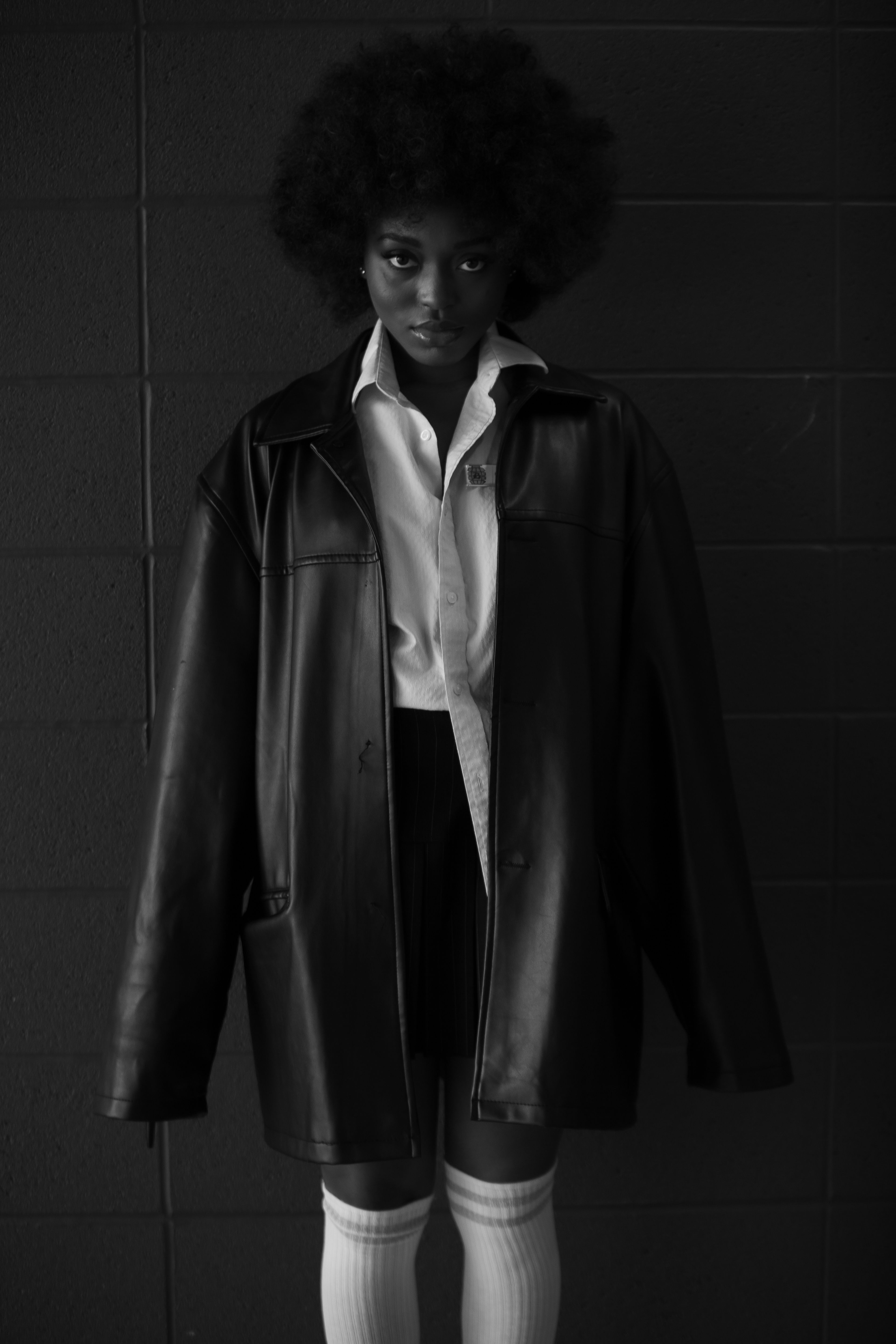 Woman in Black Coat Standing in Front of Wall · Free Stock Photo