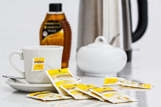 A cozy setting featuring Twinings camomile tea with honey, perfect for a relaxing moment.