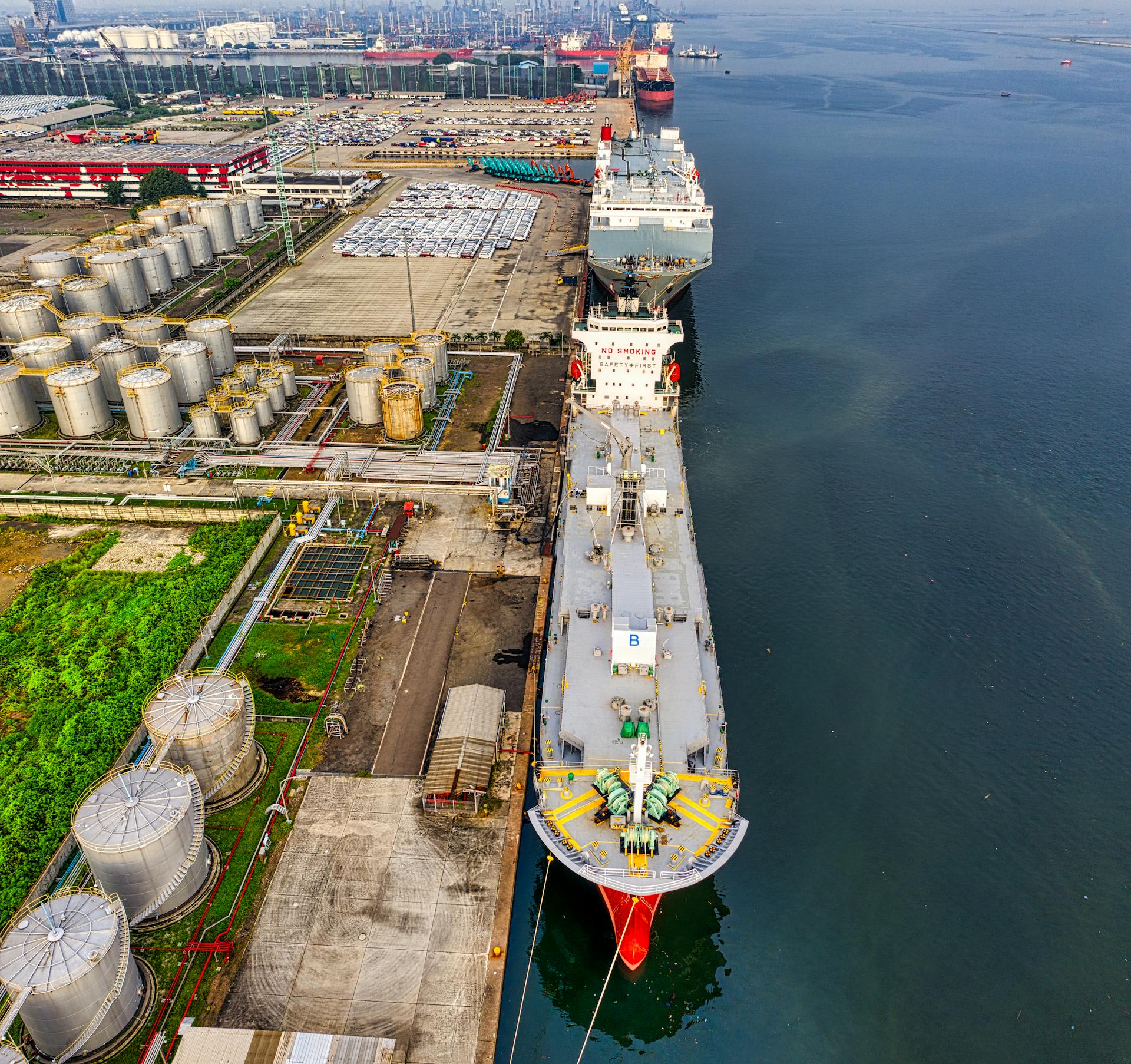Aerial shot of oil tankers and storage facility in North Jakarta, Indonesia.