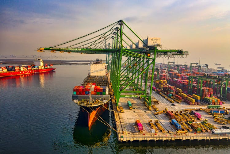 Drone Shot Of A Docked Cargo Ship At A Port