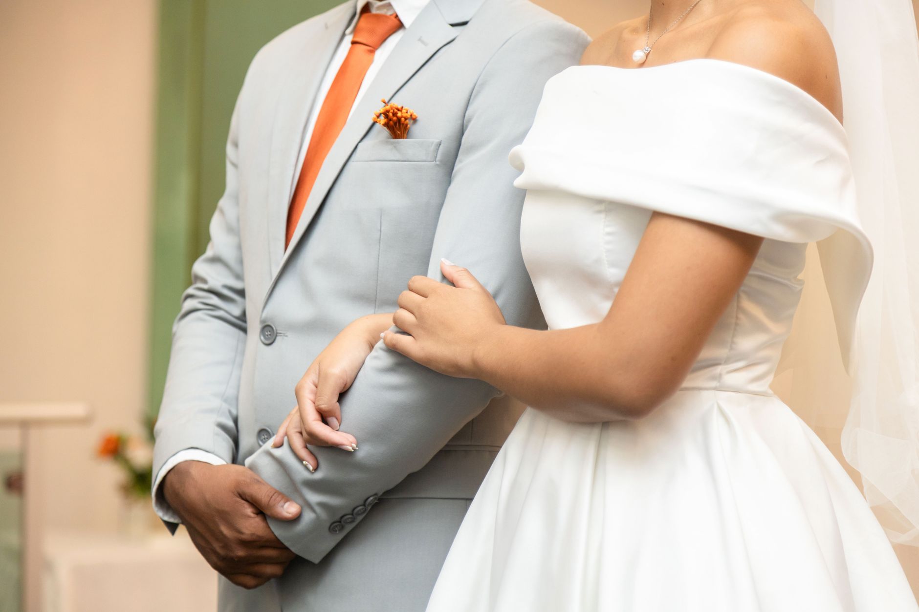 luxury wedding venues north coast egypt — Close-up of a couple holding hands, showcasing elegance in wedding attire.