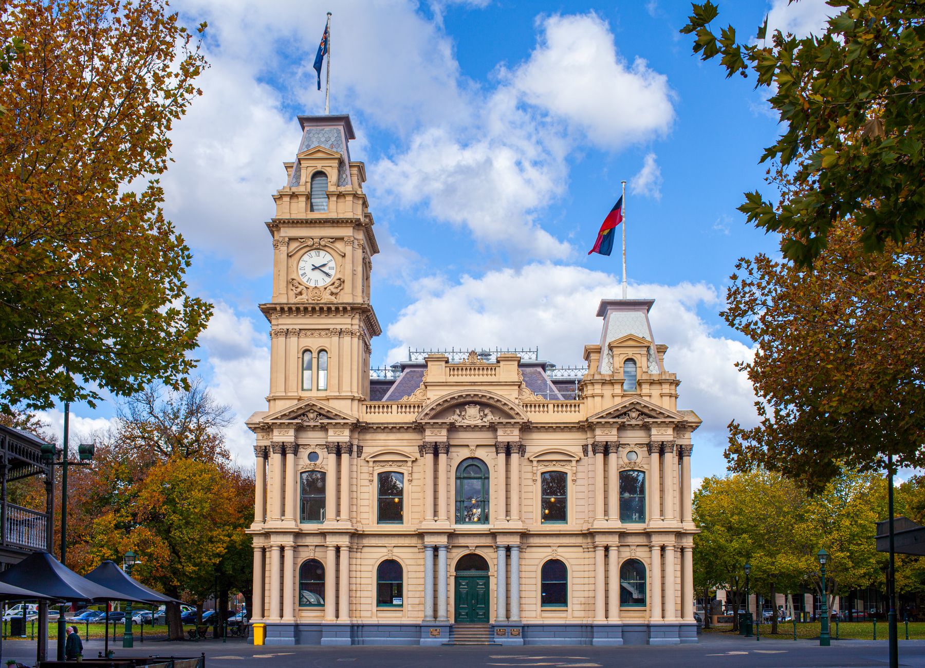 Historic Bendigo Town Hall with bright autumn foliage in Victoria, Australia.