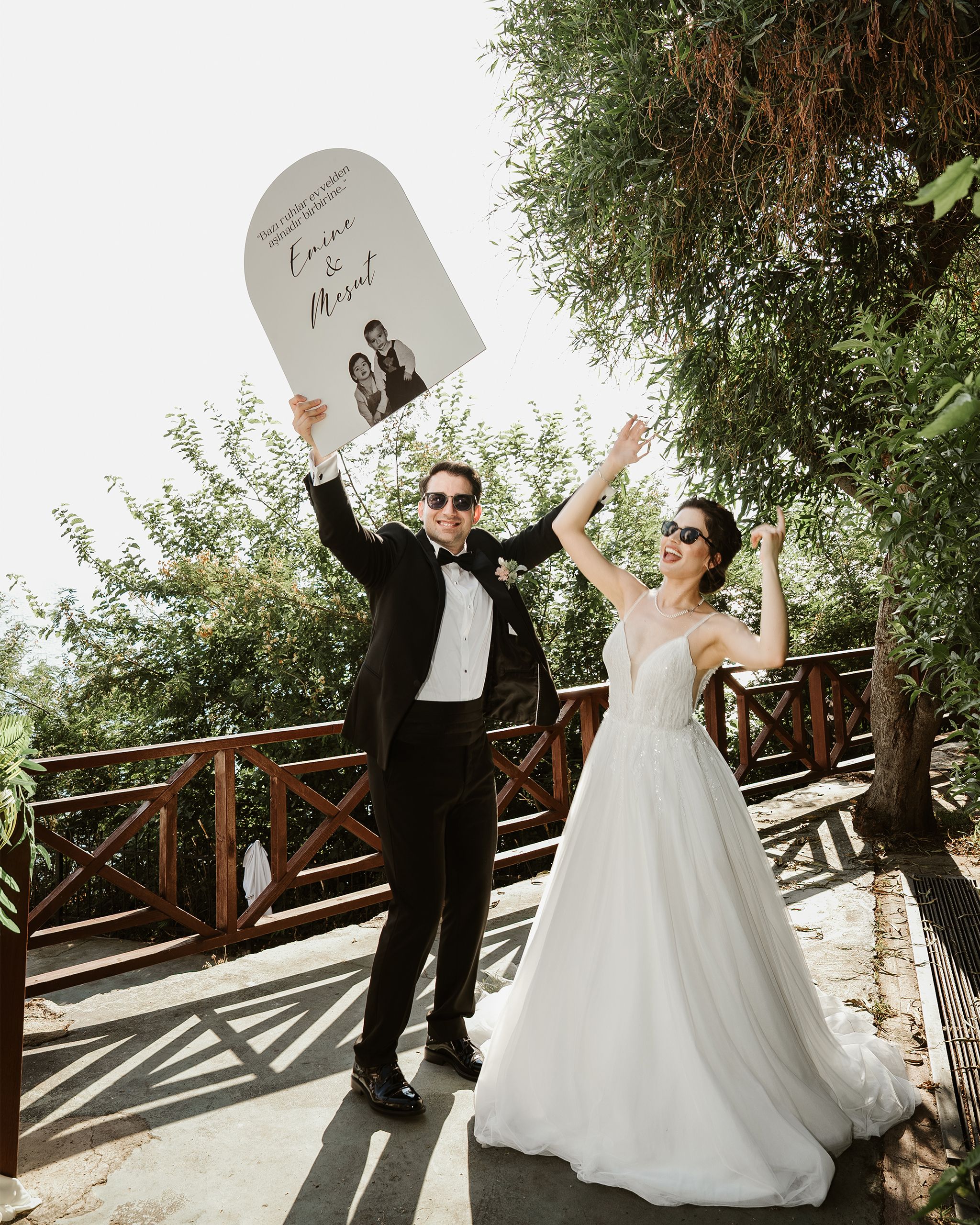 Bride and groom celebrating their wedding outdoors in Antalya with a cheerful vibe.