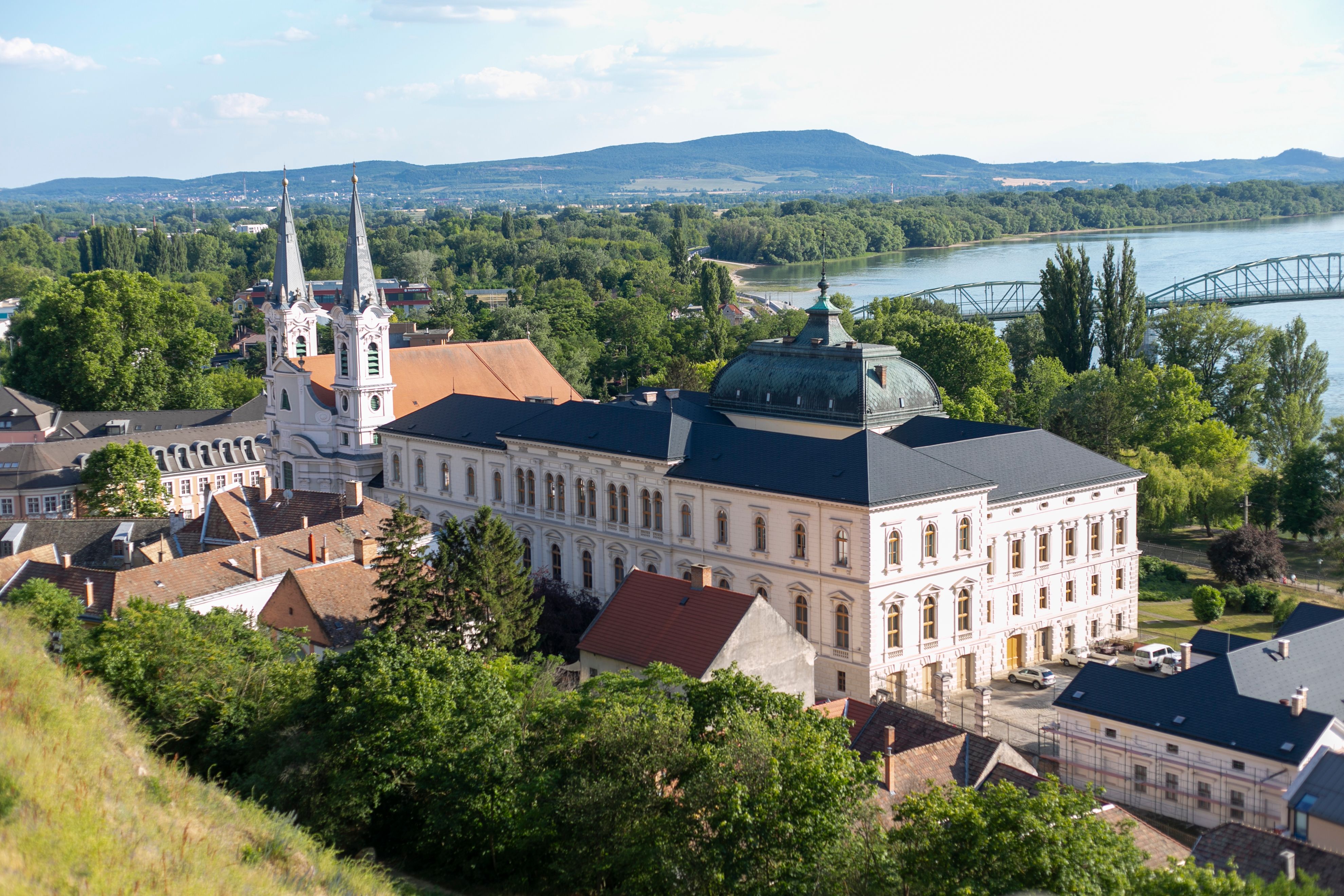 A scenic aerial view of Esztergom with the Danube River and classic architecture.