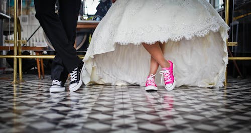 Woman Wearing Pink and White Low Top Shoes Dancing Beside Man