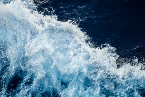 Free A dramatic close-up of ocean waves crashing, showcasing the power and beauty of nature. Stock Photo