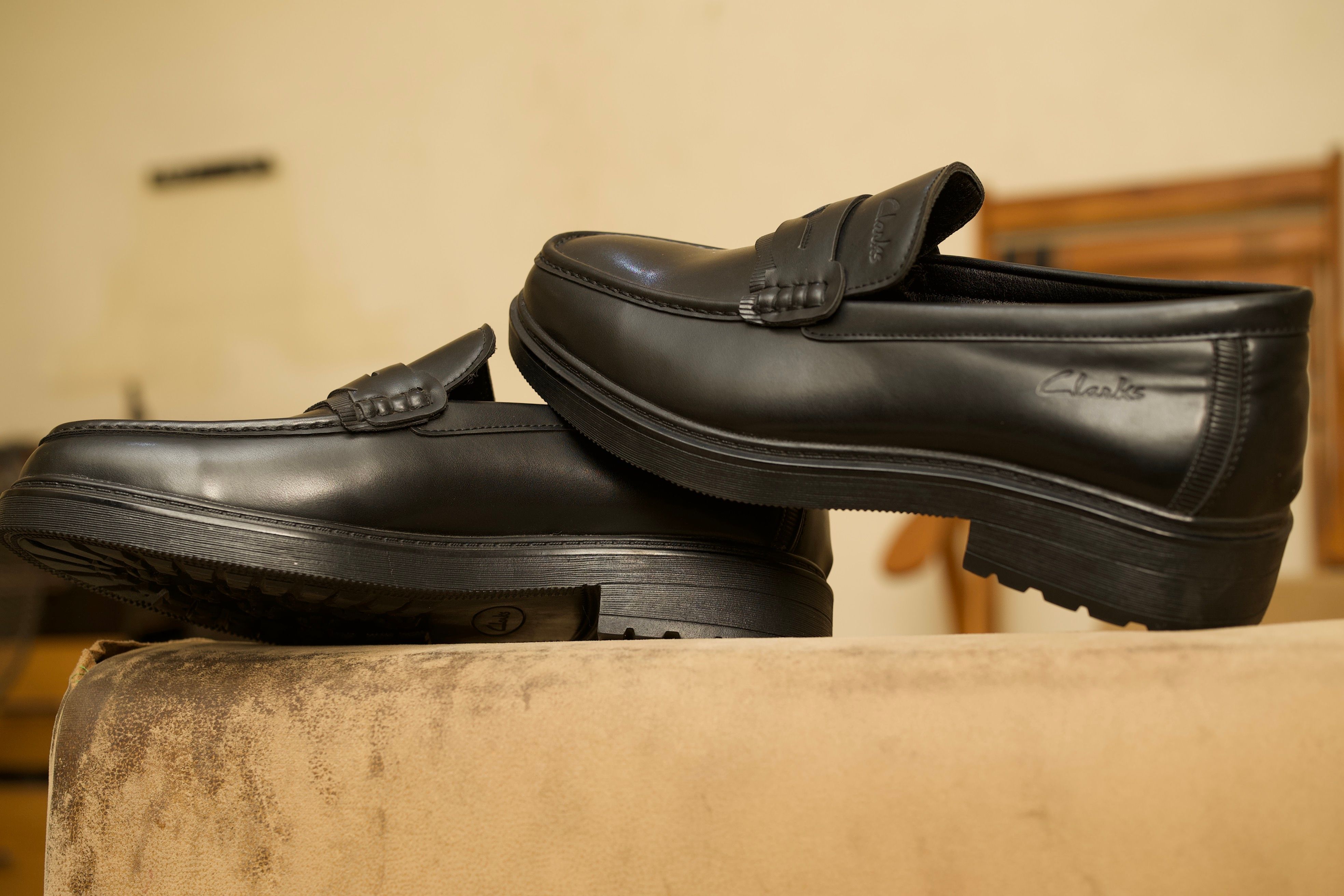 Stylish black leather loafers ideal for formal and smart casual occasions.