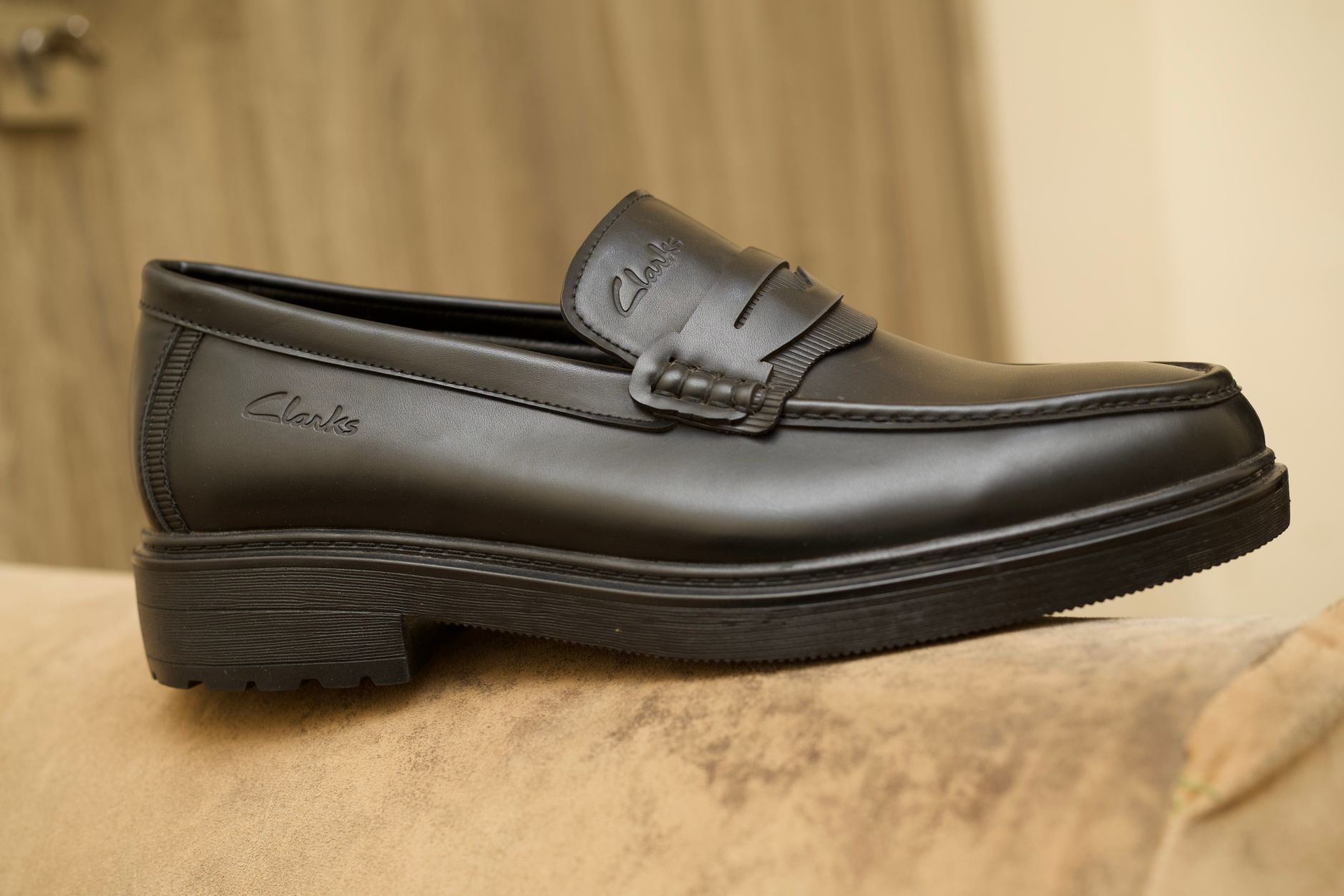 Stylish black leather loafer, perfect for business casual or formal wear, showcasing quality craftsmanship.