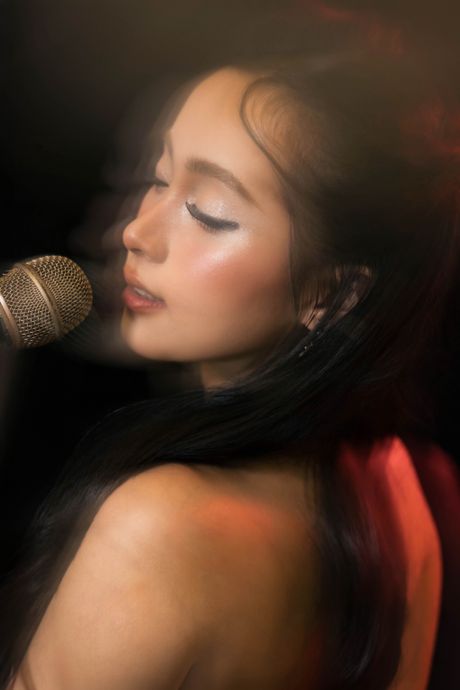 Portrait of a woman singing — photo by Tran Kien on Pexels