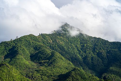Free Stunning view of lush green mountains covered in clouds in Dong Van, Vietnam. Stock Photo