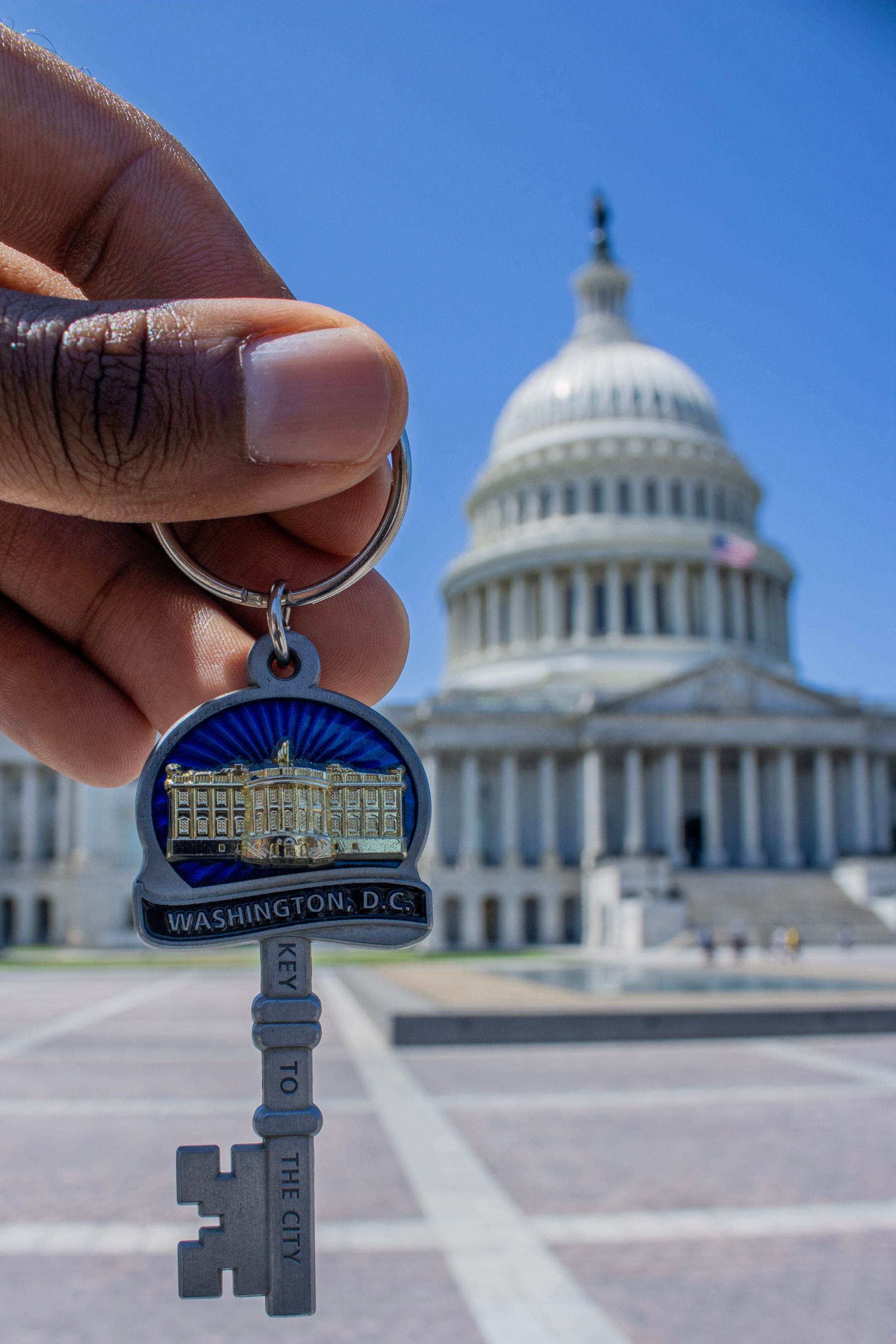 Washington D.C. keyring held in front of the U.S. Capitol