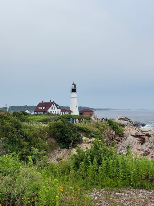 Free Scenic view of the iconic Portland Head Light on a cloudy day in Cape Elizabeth, Maine. Stock Photo