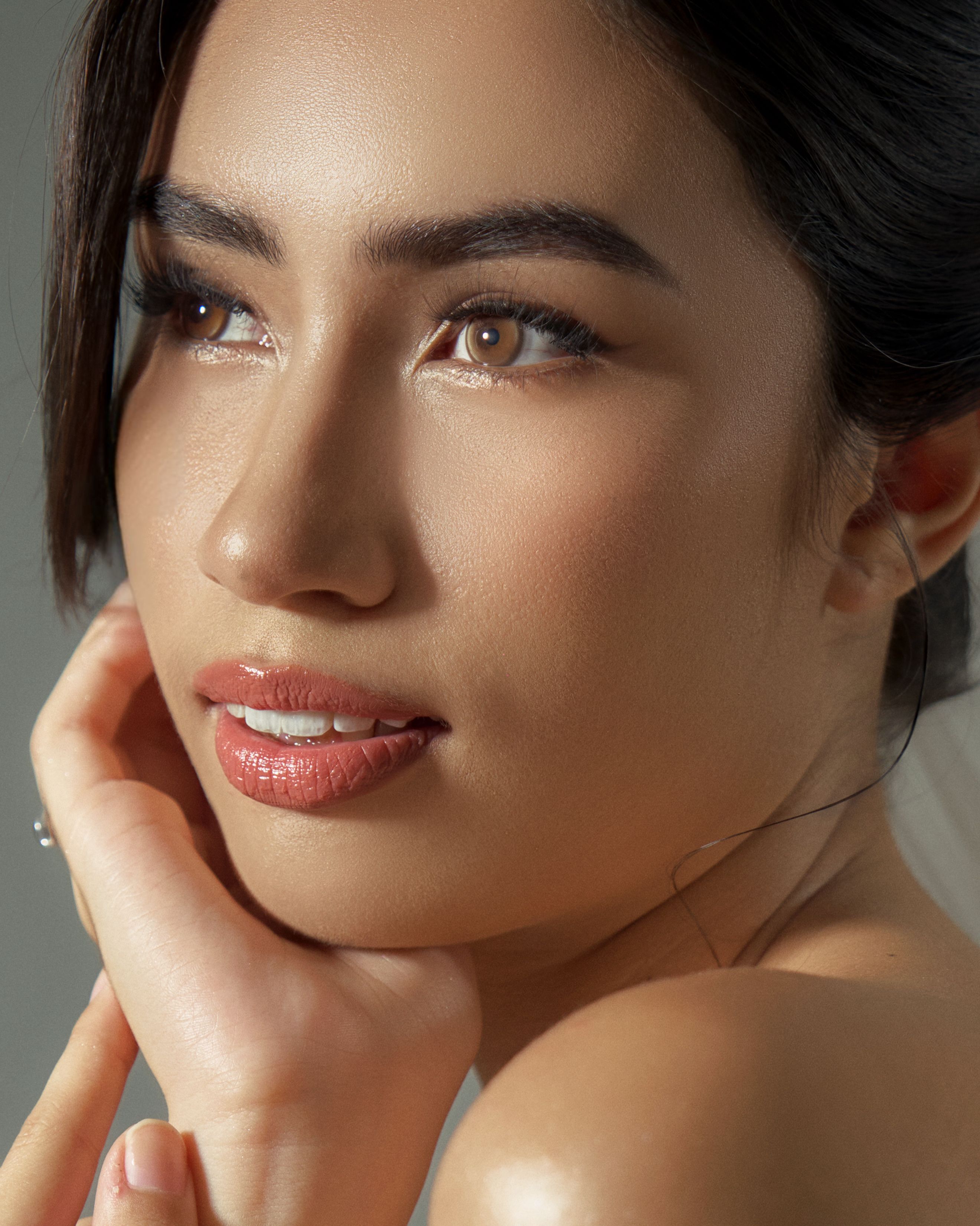 Close portrait of a woman with soft, natural make-up and healthy skin