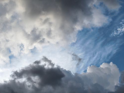 Free Moody cloud formation in Silchar, India capturing sunlight through dramatic clouds. Stock Photo