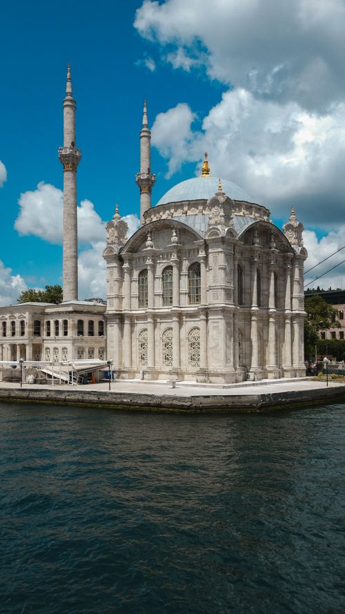 Free Scenic view of Ortaköy Mosque on the Bosphorus in Istanbul under a blue sky with clouds. Stock Photo