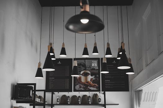 Stylish cafe interior with modern pendant lights and rustic decor for a cozy ambiance.