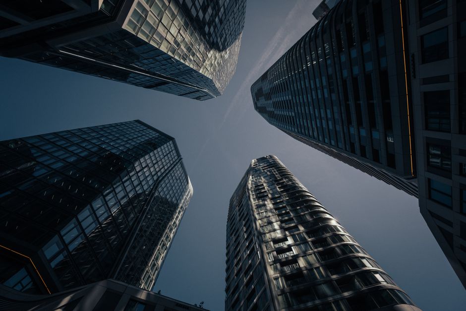 Impressive upward view of Frankfurt skyscrapers captured at dusk, highlighting modern architecture.