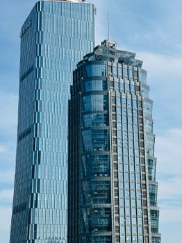 Tall modern skyscrapers in Chongqing, China, showcasing urban architecture against a clear sky.
