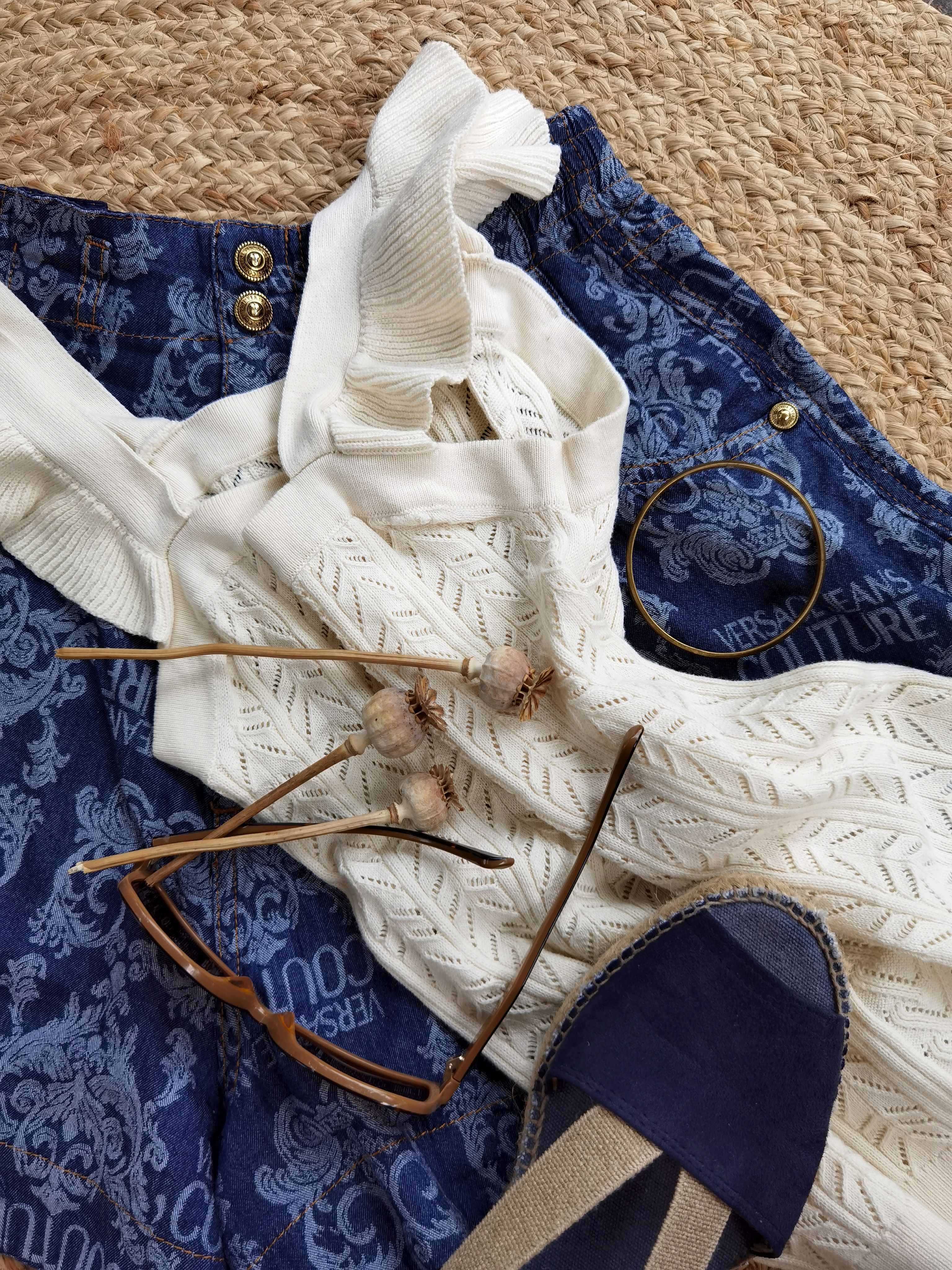 Trendy flat lay of women's clothing and accessories with a chic summer vibe.