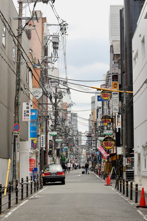 Free Explore the vibrant urban life of Osaka with this candid street view. Stock Photo