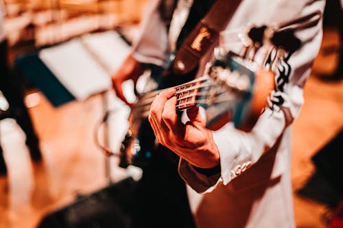 Person Playing Guitar