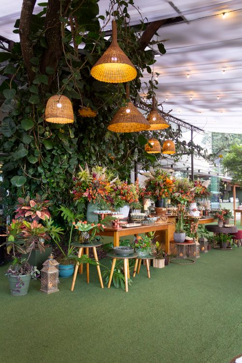 Free Colorful wedding decor with orange floral arrangements and wicker lamps in São Paulo, Brazil. Stock Photo