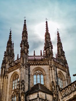Stunning view of the Gothic spires of Burgos Cathedral against a bright sky in Spain.