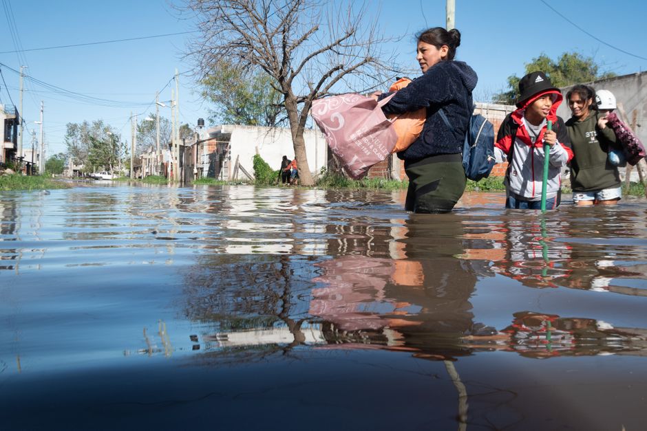 neighbors helping each other during flood with supplies and coffee