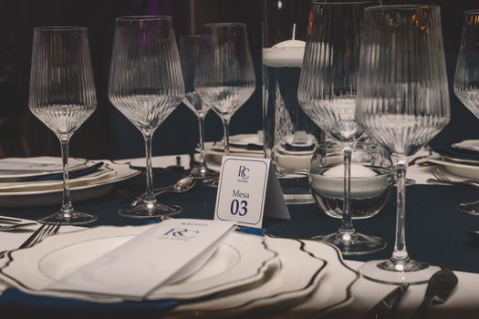 Luxurious dining setup with fine glassware and tableware in Luanda, Angola.
