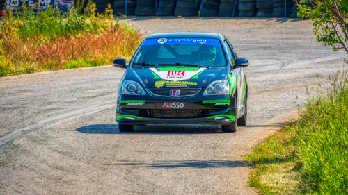 Free Dynamic car racing captured on a winding road in Ritsona, Greece. Stock Photo