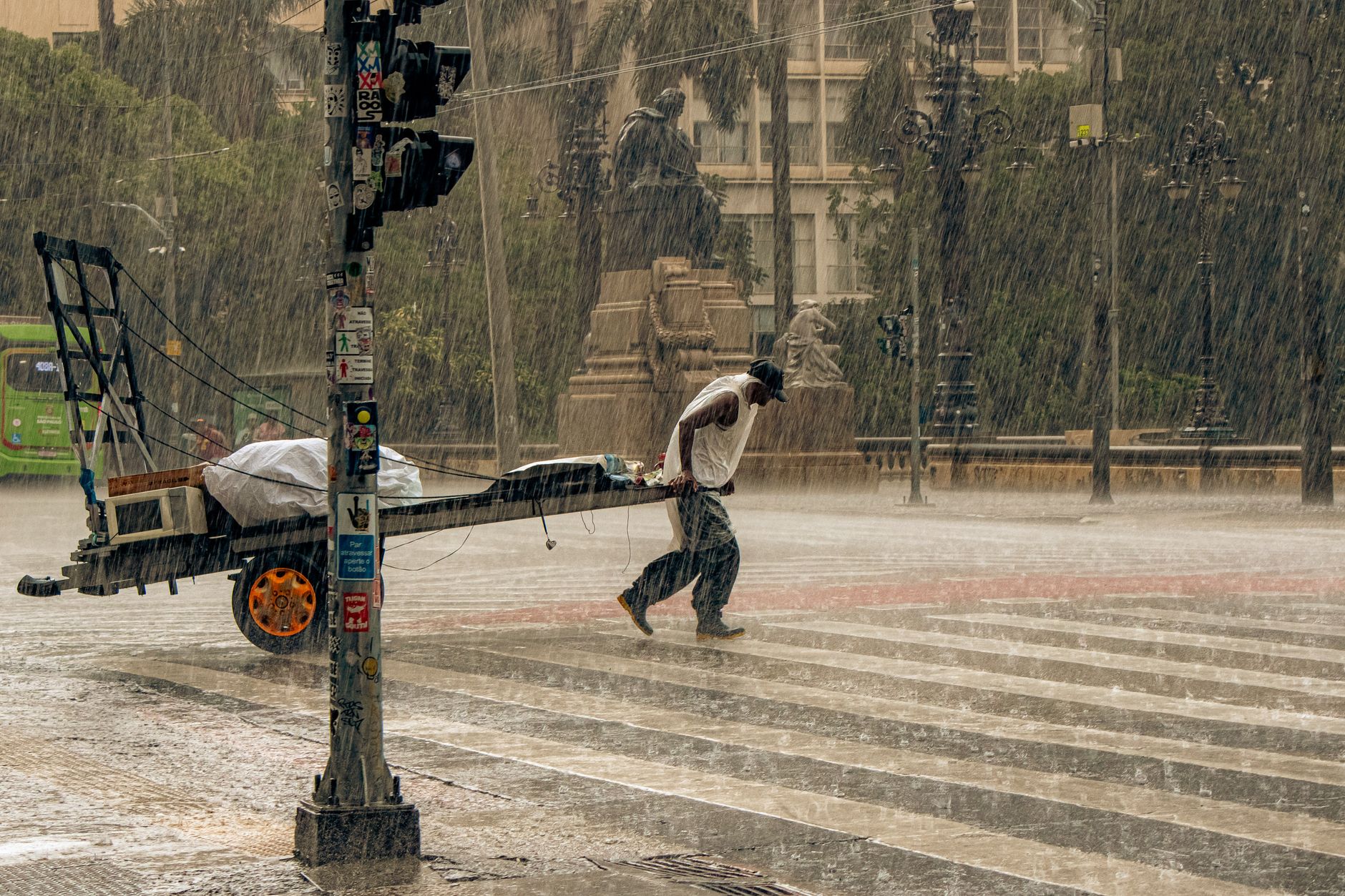 Heavy rain flooding a Bangkok street during afternoon monsoon downpour