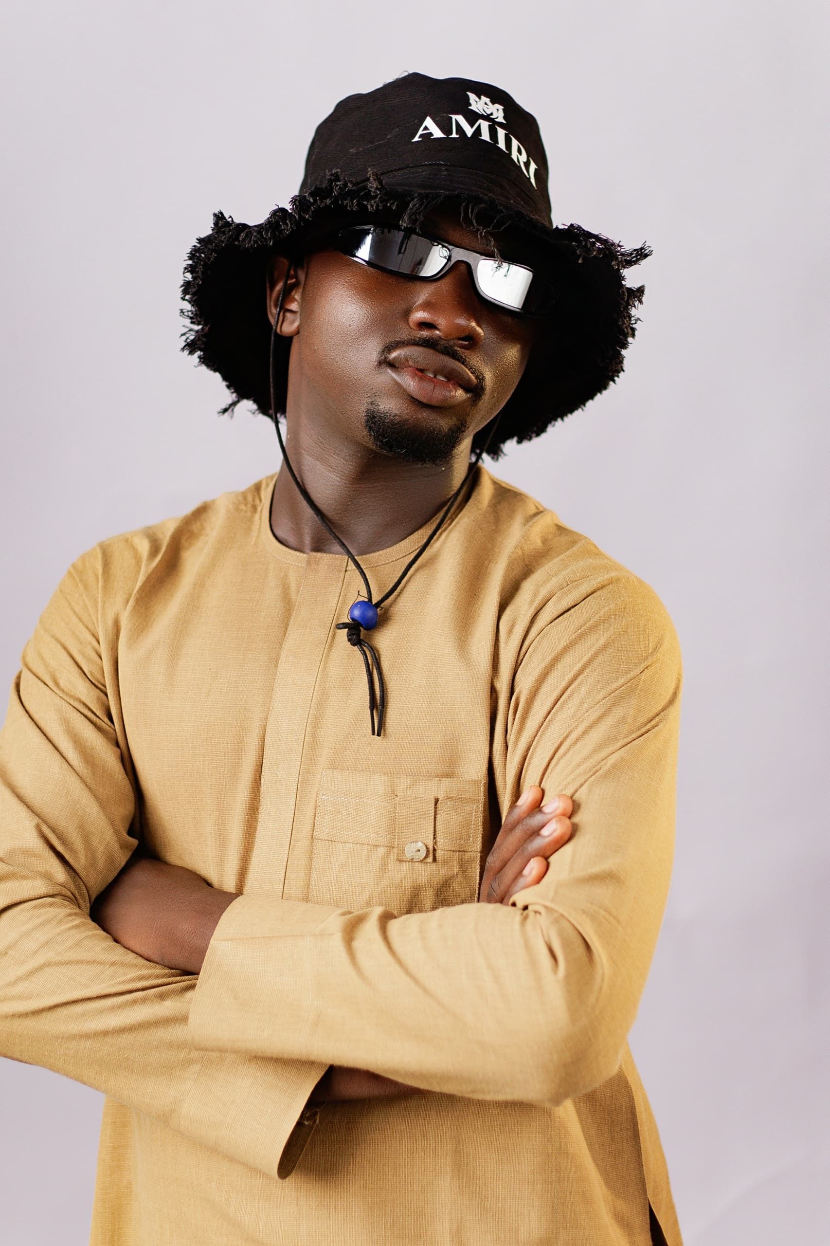 Fashion portrait of a trendy man with hat and sunglasses, casual chic style.