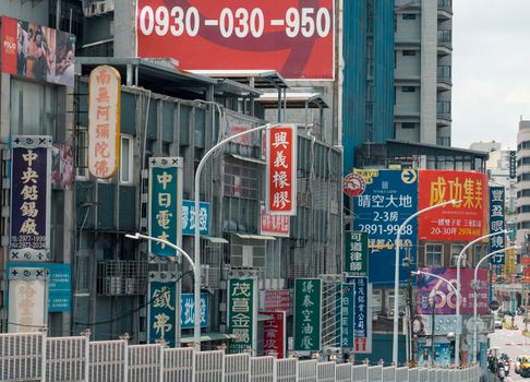 Lively urban scene with colorful street signs in central Taipei, Taiwan.